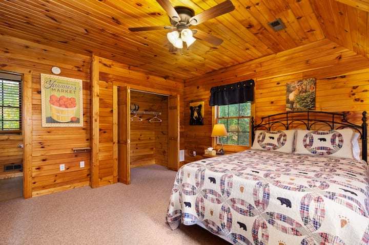 Upstairs bedroom with queen bed and en-suite bathroom, tastefully decorated. 