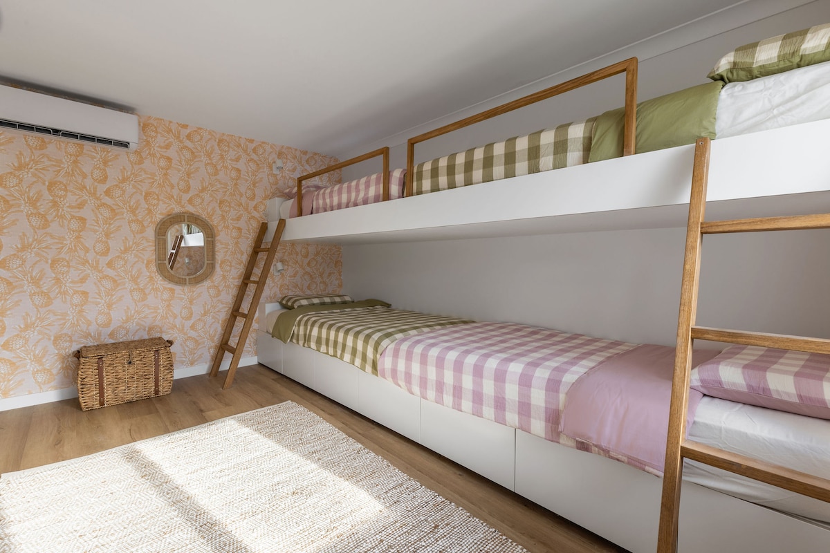 The Bunk Room consists of 2 King Singles and 2 Standard Singles. Each bunk has its own reading light feature, plus A/C and a wall mounted TV for the kids! 