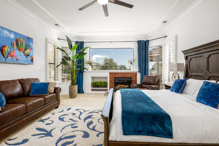 Master bedroom with King size memory foam mattress, 65" flat screen, fireplace