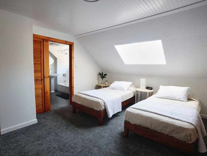 The second upstairs bedroom features either two twin beds or one king if pushed together. Both upstairs bedrooms share a full bathroom. 