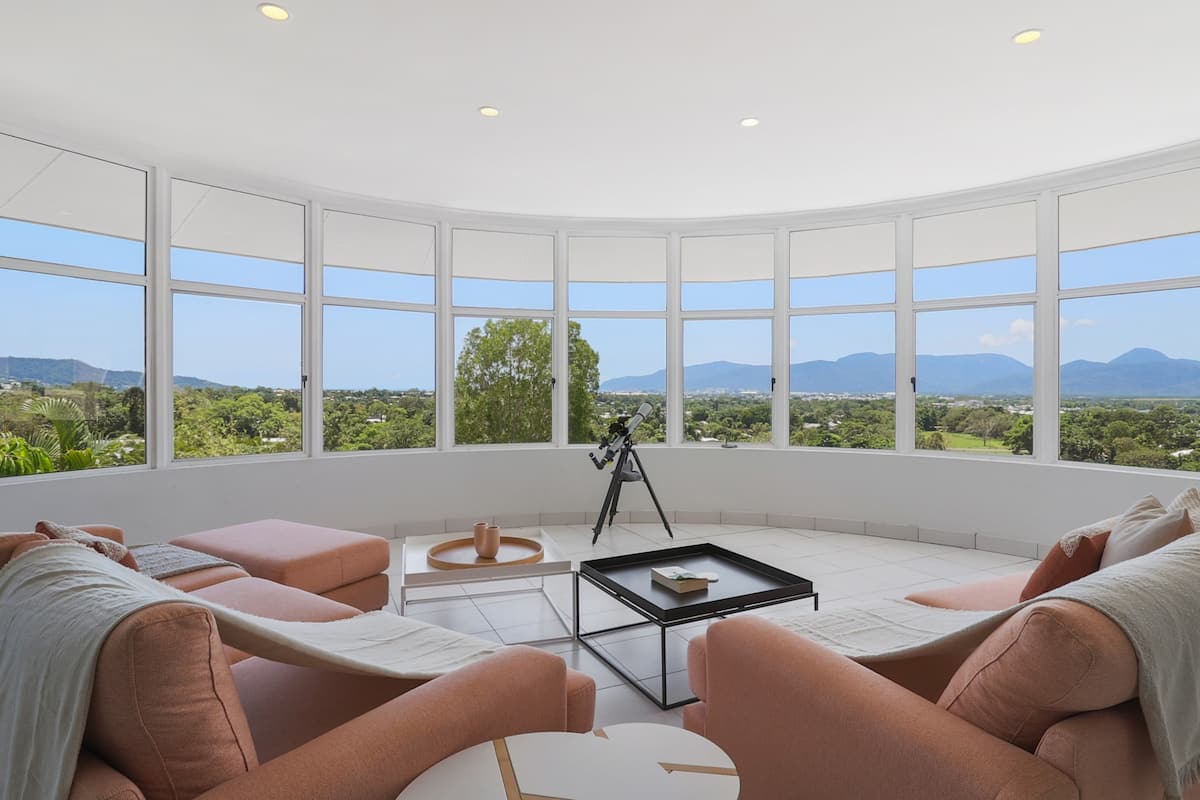 Living room with windows showcasing the views of Castle in the Sky, Mooroobool