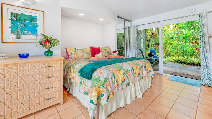 Snuggle up in your super comfy king bed in the middle of your tropical garden in our sweet studio cottage.  Two private lanais, one on each side of you ... one leading out to your own hot tub. 