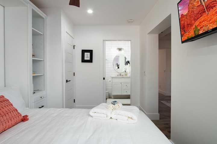 The third bedroom, also located downstairs, features a luxurious queen-sized bed and en suite bathroom