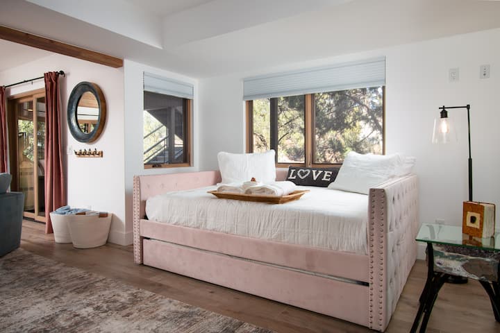 The second living room, featuring this charming trundlebed,  is located on the lower floor