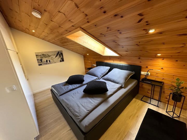 Cozy bedroom with sky view completely darkenable.