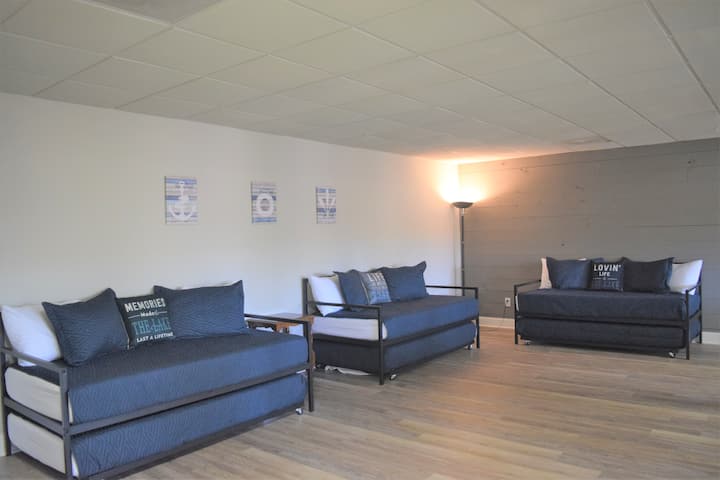 Three twin daybeds with trundles, to sleep 6 total.