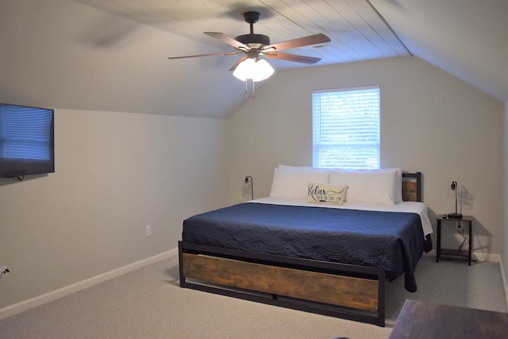 The upstairs level features two "Jack and Jill" style bedrooms, each with their own smart TVs and desks.  All the bedside lamps have USB ports for your convenience. 
