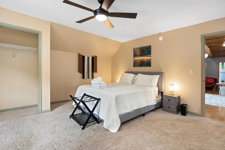 Cozy family-friendly nook designed for children to read, play, unwind, and enjoy quiet moments while parents gather nearby in the home’s spacious living and dining areas.