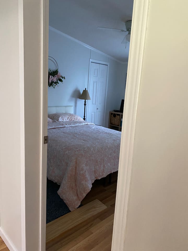 Second bedroom with full bed, directly across the hall from second bathroom. All bedroom doors lock for privacy.