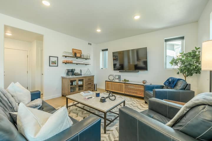 Family room couch,  two club chairs, coffee bar, & 75 inch TV with sound bar & unlimited channels