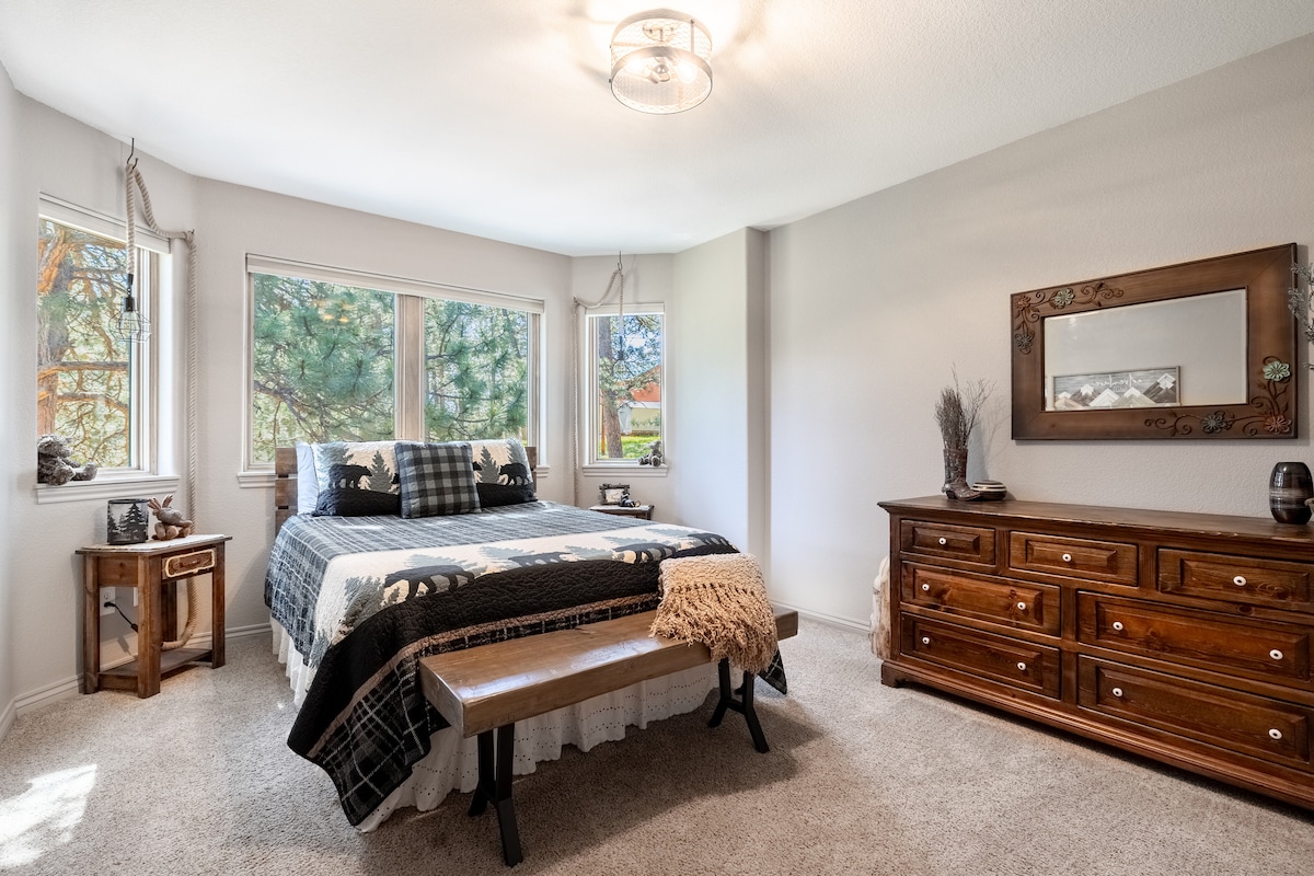 The "Mountain Room" with queen bed. Every room has a fan, sleep/noise machine, extra pillows, lots of hangers and blankets. Room is on the second story.