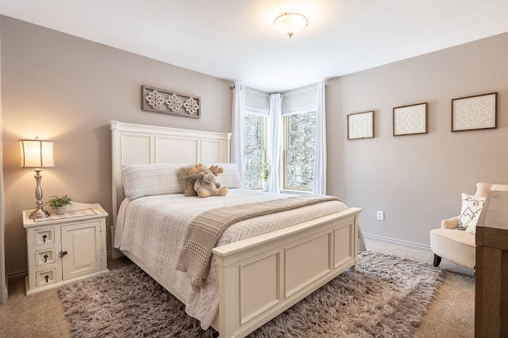 The "Farmhouse Room" with queen bed. Pack n Play crib, ironing board. Every room has a fan, sleep/noise machine, extra pillows, lots of hangers and blankets. Room is on the second story.