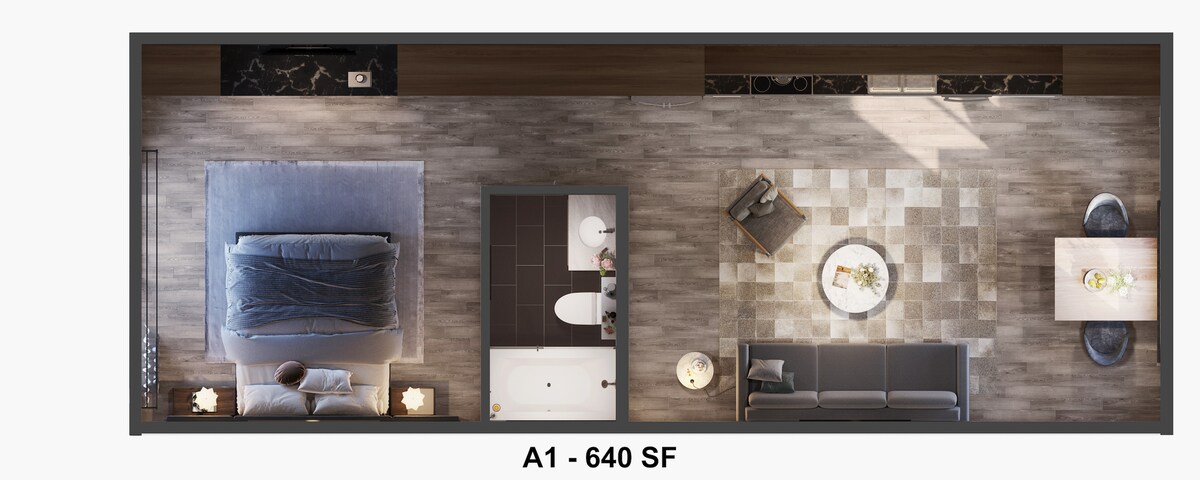 An overhead view of a spacious layout features a bedroom with a large bed and soft bedding, adjacent to a cozy seating area that includes a sofa and table. The bathroom, visible to the side, contains a bathtub and modern fixtures, enhancing the overall design.
