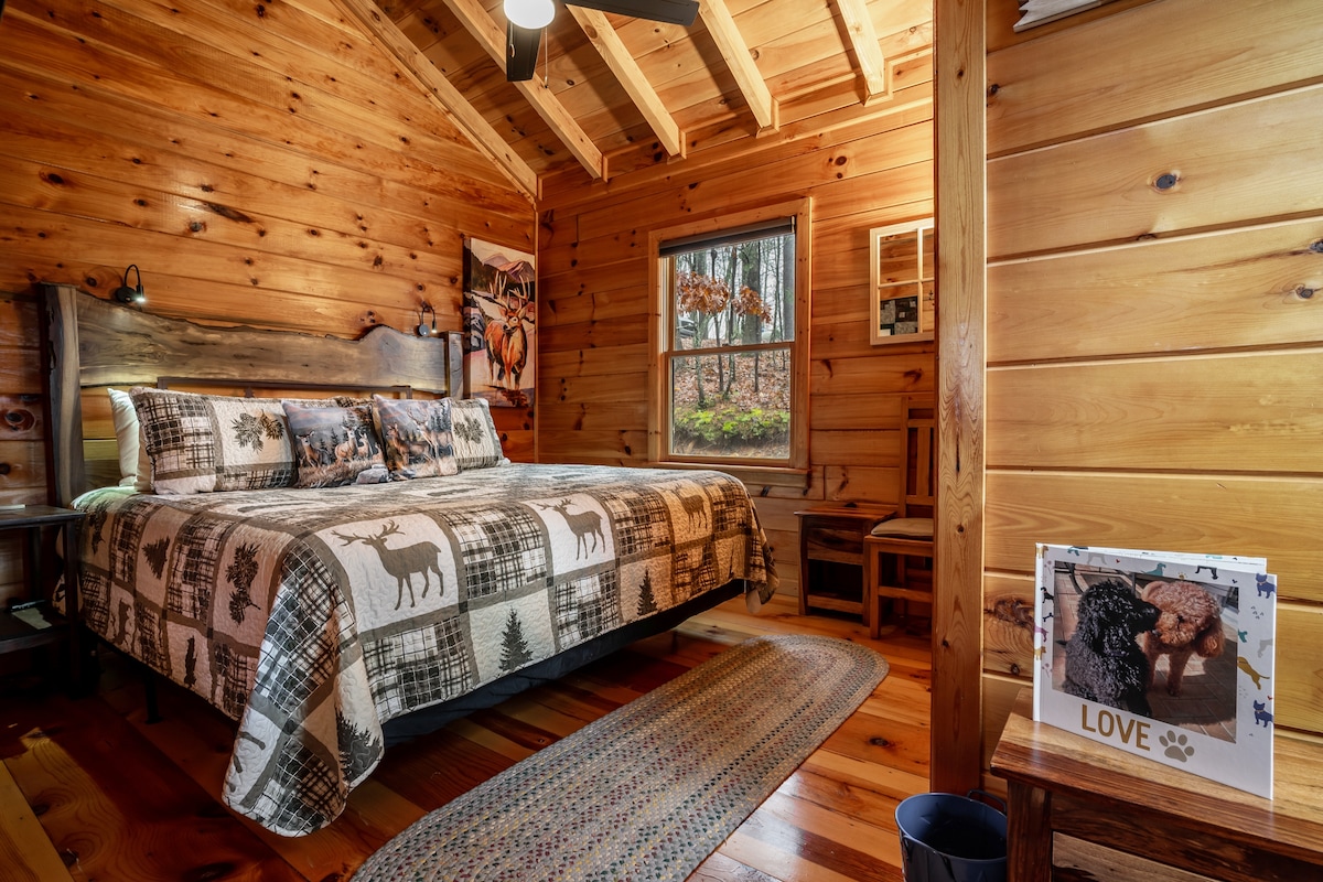 Deer and Bear Themed King Bedroom. 
Sum Fun: A Log Cabin. Blue Ridge Mountain views, dog friendly with fully fenced yard, hot tub, fire pit, 2 decks, wood burning fireplace, game room: Foosball, dart board, life-sized games, & more