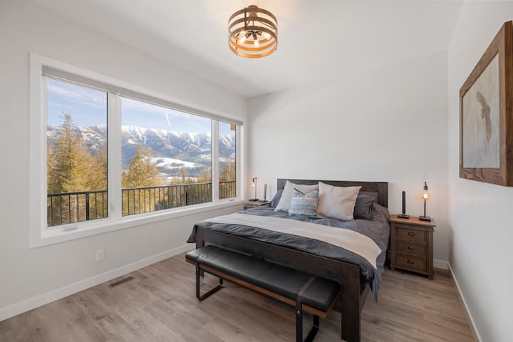 Main floor second master bedroom. This room has a king sized bedroom and ensuite full bathroom with walk in shower. Access to the front deck allows guests to future enjoy the amazing views!