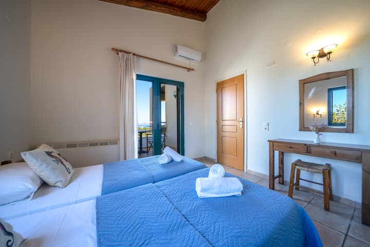 Bedroom 2 with two single beds and ensuite bathroom