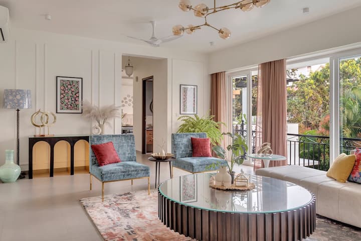 Spacious Living Room overlooking the swimming pool connected with the dining and kitchen