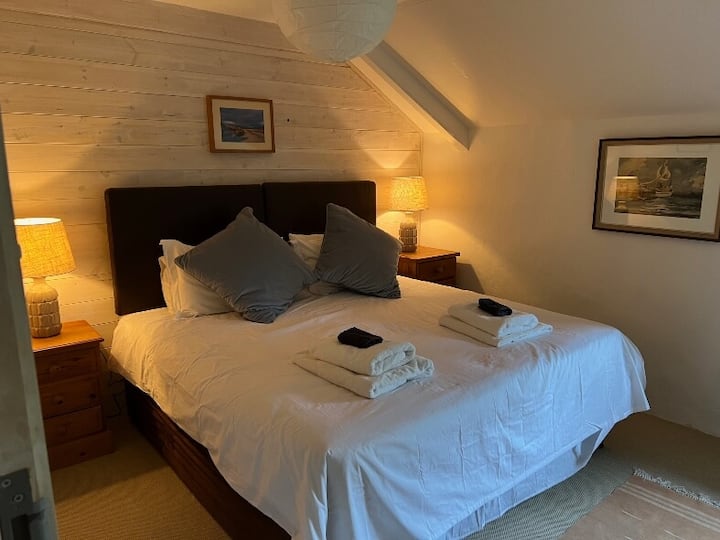 This king sized bed can be divided into two large singles.  It has its own family sized bathroom just down the corridor with a large bath and walk in shower.