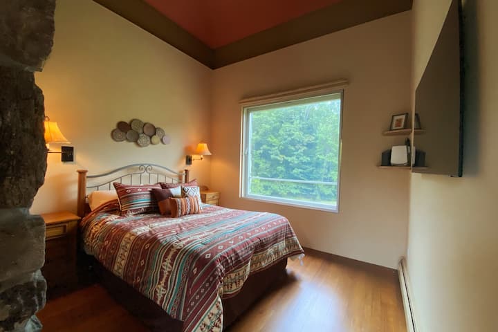 Top Floor Master. Best view in the house. Mounted TV, and full private bathroom with walk in closet.
