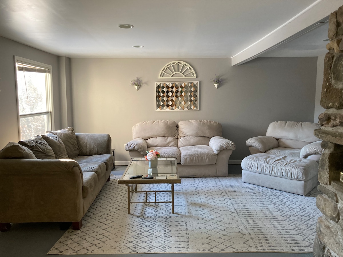 Downstairs living room with additional TV