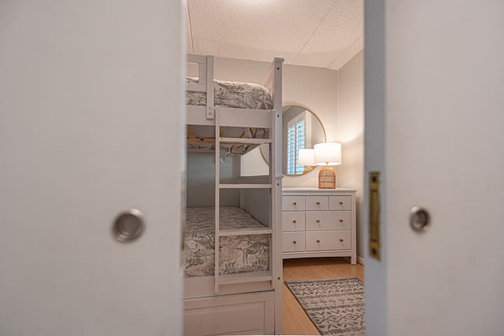 You will find pocket doors leading to the 3rd bedroom that can accommodate upto 5. 
Premium linens provided.