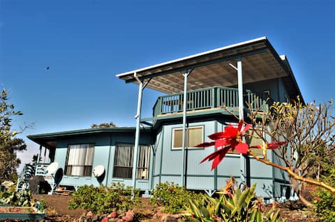 Kai Mana Hale. Black and green sand beach. Volcano