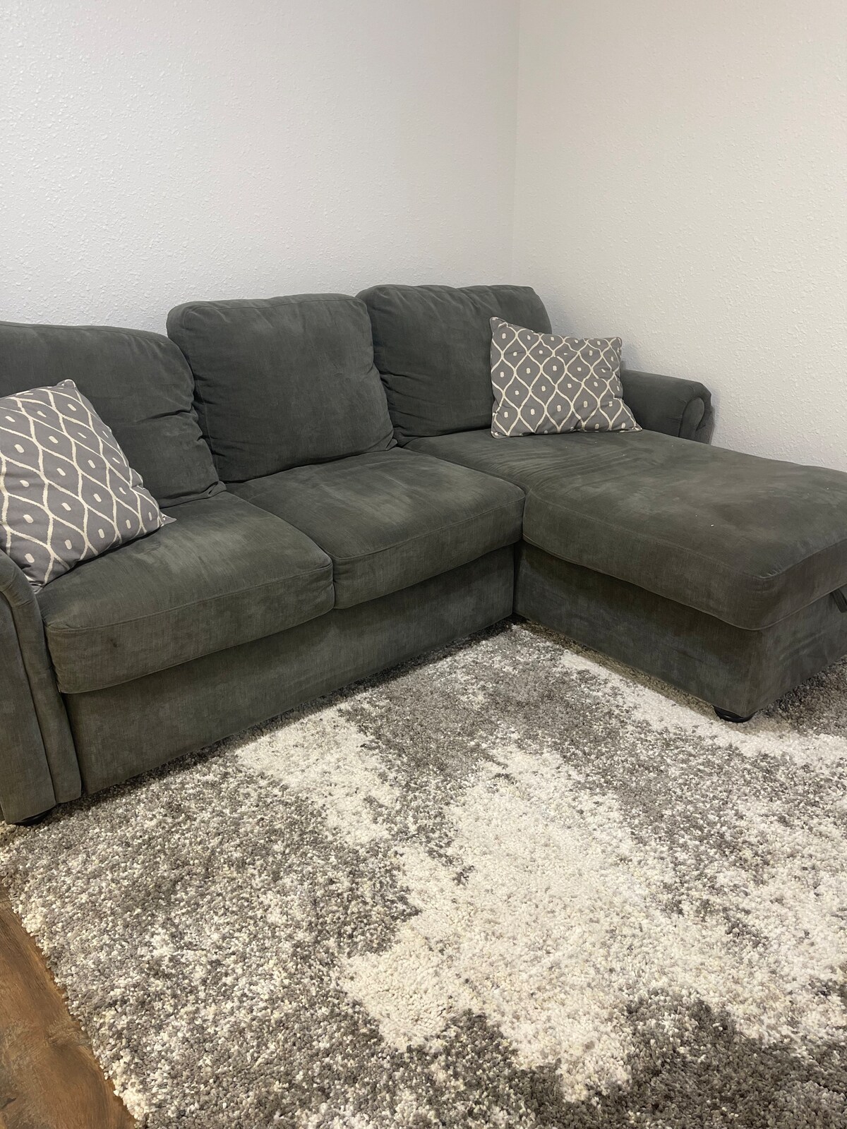 This sofa with attached chaise lounge converts into a queen bed when needed, and is located in the game room that can easily be used as a fourth bedroom. 