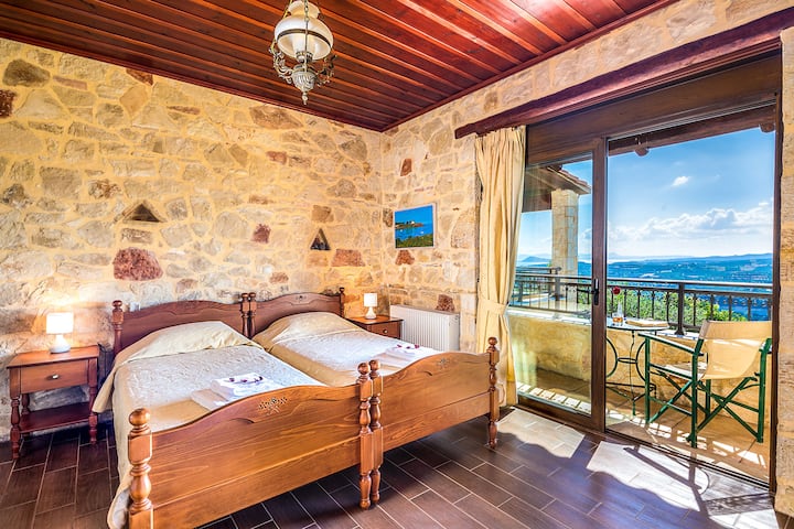 Ground Floor: Bedroom 2 with two single beds, ensuite bathroom with hydro-massage shower and private balcony with sea view.