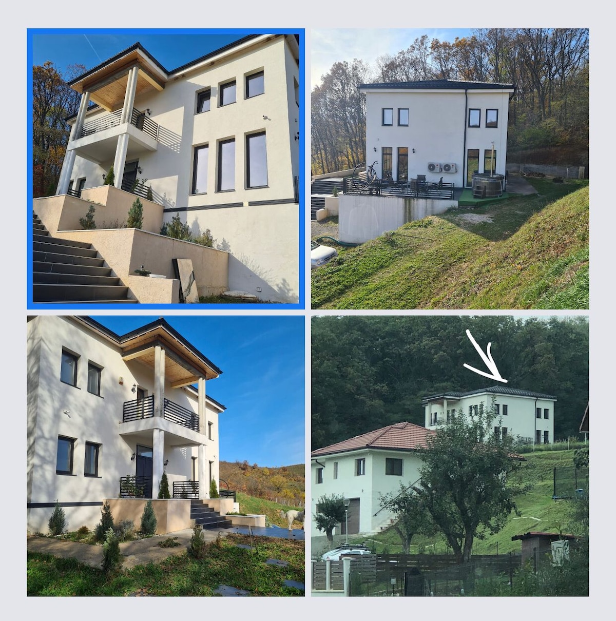 The exterior of a modern villa is depicted, showcasing a symmetrical design with large windows and a covered balcony on the upper level. Green sloping hills surround the property, providing a natural backdrop. A pathway leads to the entrance, complemented by neatly arranged shrubs.