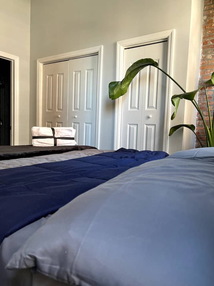 The two folding doors on the right are full closets. The Open door to the left is the En Suite Bath.