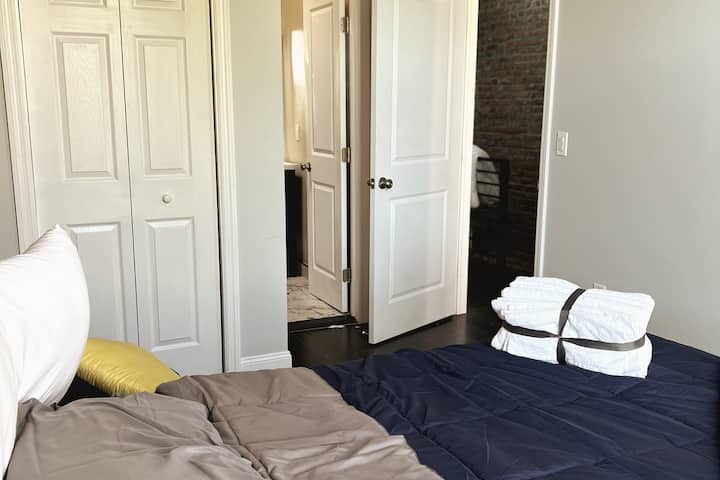 Bedroom 2 with En Suite Full Bath. You have a full closet and smart Tv in the room. 