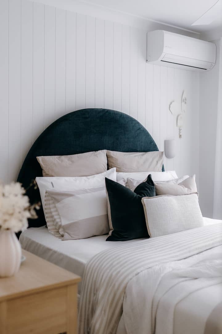 Guest Bedroom One, features a queen bed with firm spring mattress with bamboo mattress pillow topper