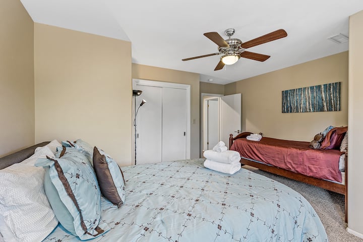 Second bedroom with one queen bed and one twin bed.