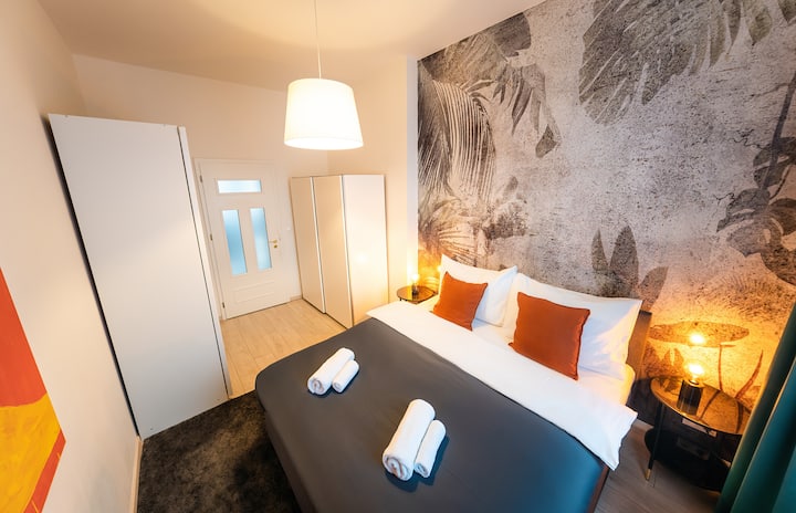 A well-kept bedroom with soft textures and a welcoming, restful vibe.
