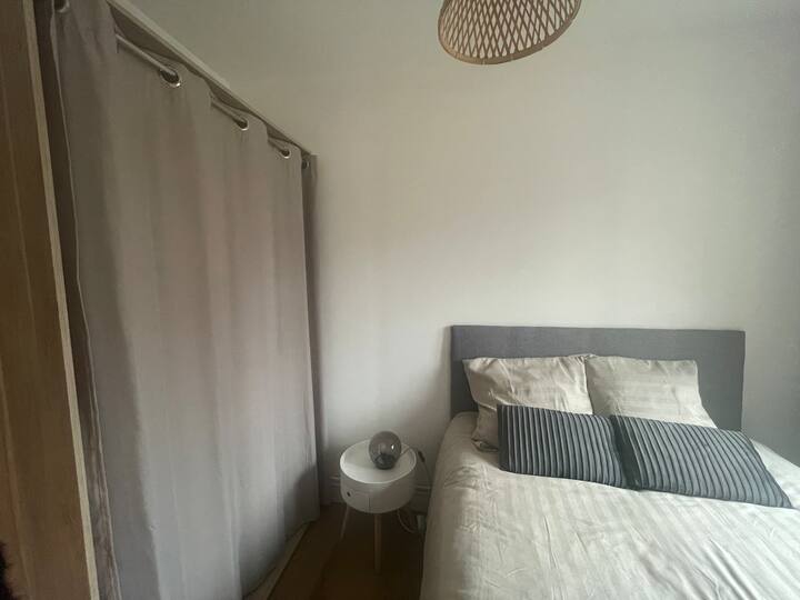 Small bedroom with dressing room, view of the Belfry 