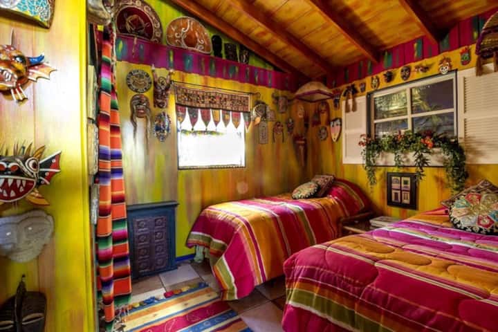 Bedroom with 2 twin beds and mask collection 