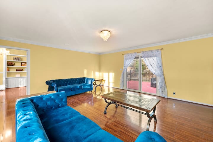 Sunlit living room is the perfect place to unwind and warm up with family and friends.