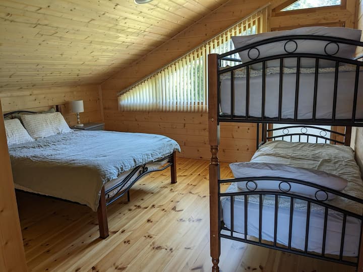 Largest bedroom with queen size bed plus double bunks