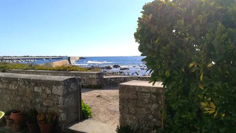 Fisherman's house at the foot of the seawall