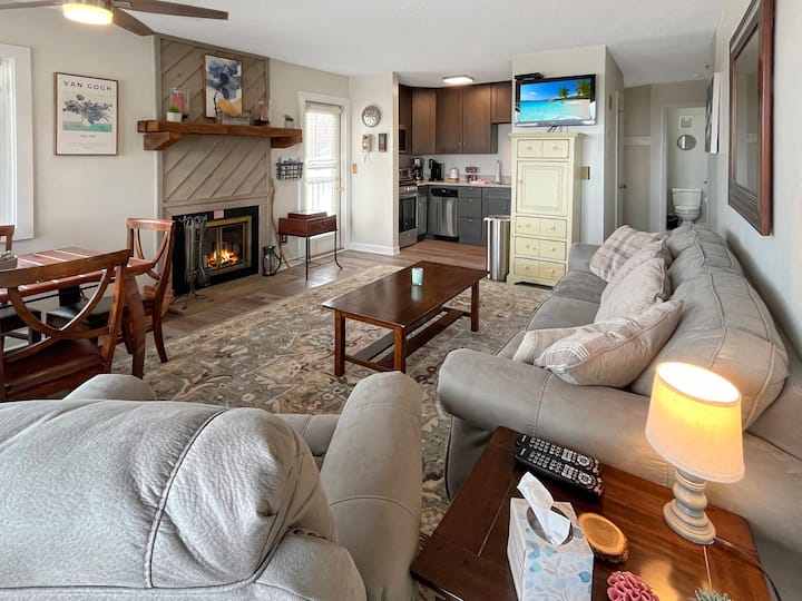 Enjoy the living room with cozy fireplace, TV, full kitchen and 2 walk out decks.  Perfect place for the family to tell stories.  