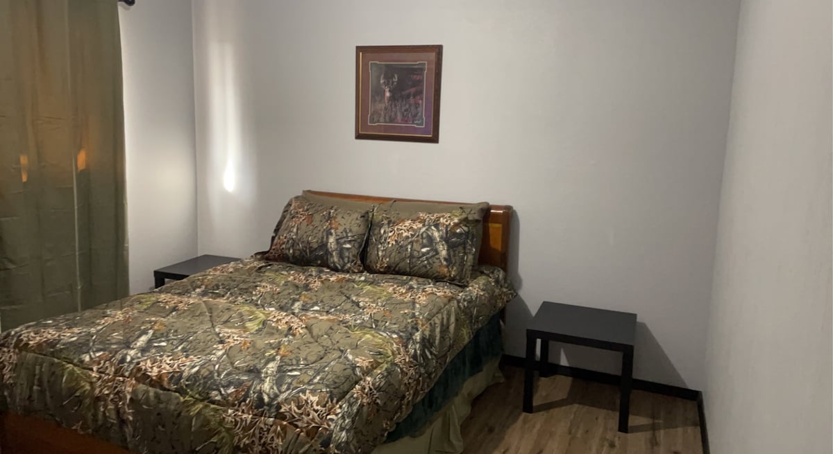 North bedroom with a queen size bed and a a closet for storage during your stay. 