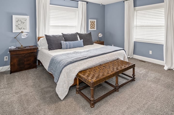 This is the SECOND King suite with a king size bed. 3/4 bathroom is attached with walk-in shower. Mattress is firm. On the wall in front of the bed is a large dresser and Roku TV.