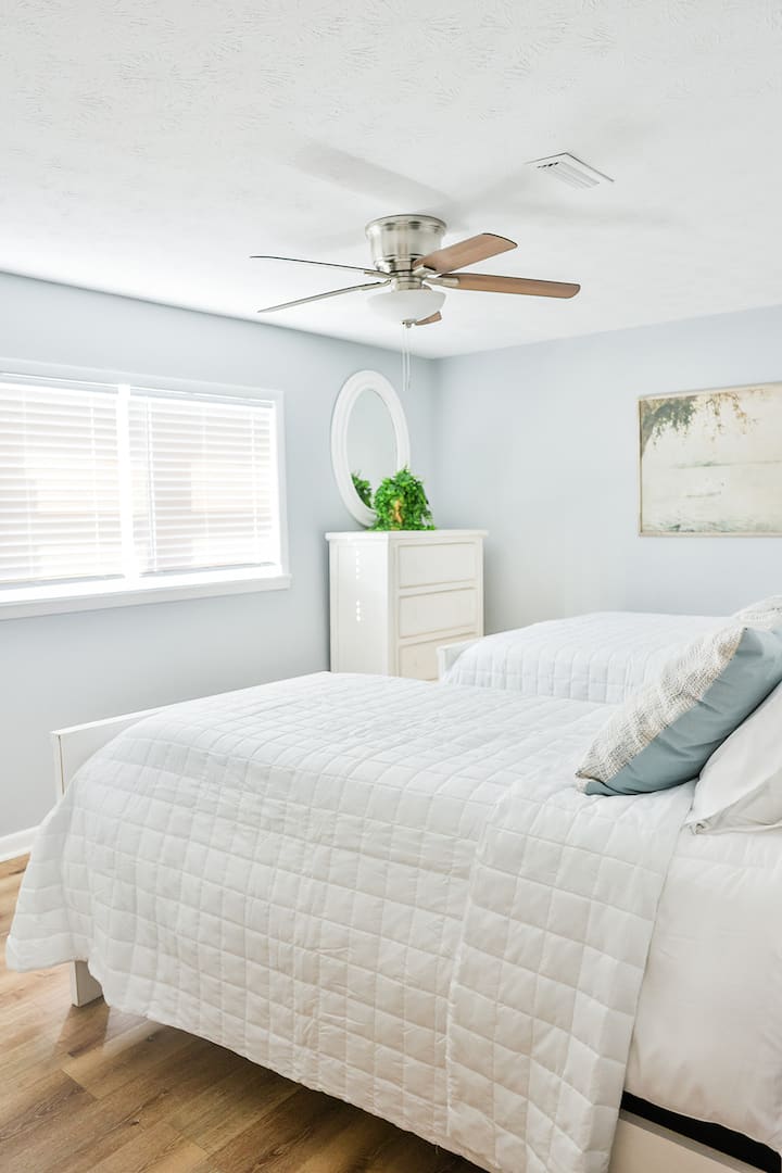 Downstairs 4th Bedroom with a full and twin size bed and chest of drawers. 