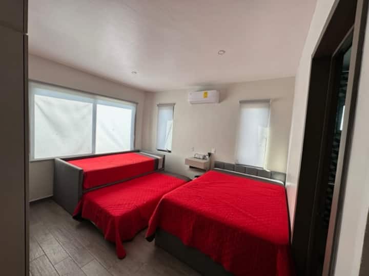 bedroom 3, two single beds, one double bed