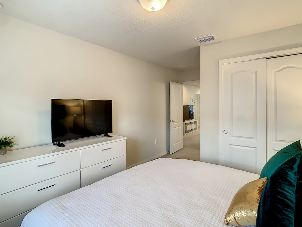 Bedroom #5 - featuring a king-sized bed and a TV for your comfort and entertainment