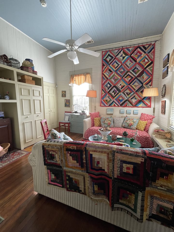 Living room with my Grandmother Emma Ellis' quilt on the wall. There is a built-in closet (left) with space to store clothing and luggage during your stay. 