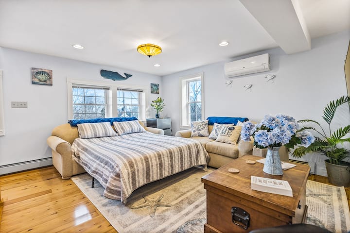 Sleep on this Queen  memory foam mattress Sleeper sofa in the living room that accommodates 2 guests