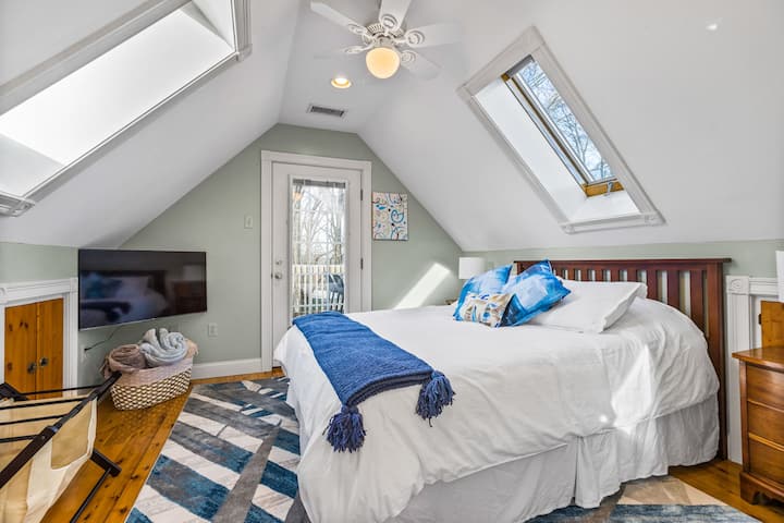 Master bedroom with Queen Bed located on 3rd floor has doorway leading to deck with fantastic views of Plymouth harbor