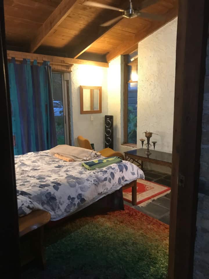 Bedroom 1 has views out into the front garden.
It also has its own new split system air-conditioner for cooling in summer and heating in winter (it can get cold here, at times).