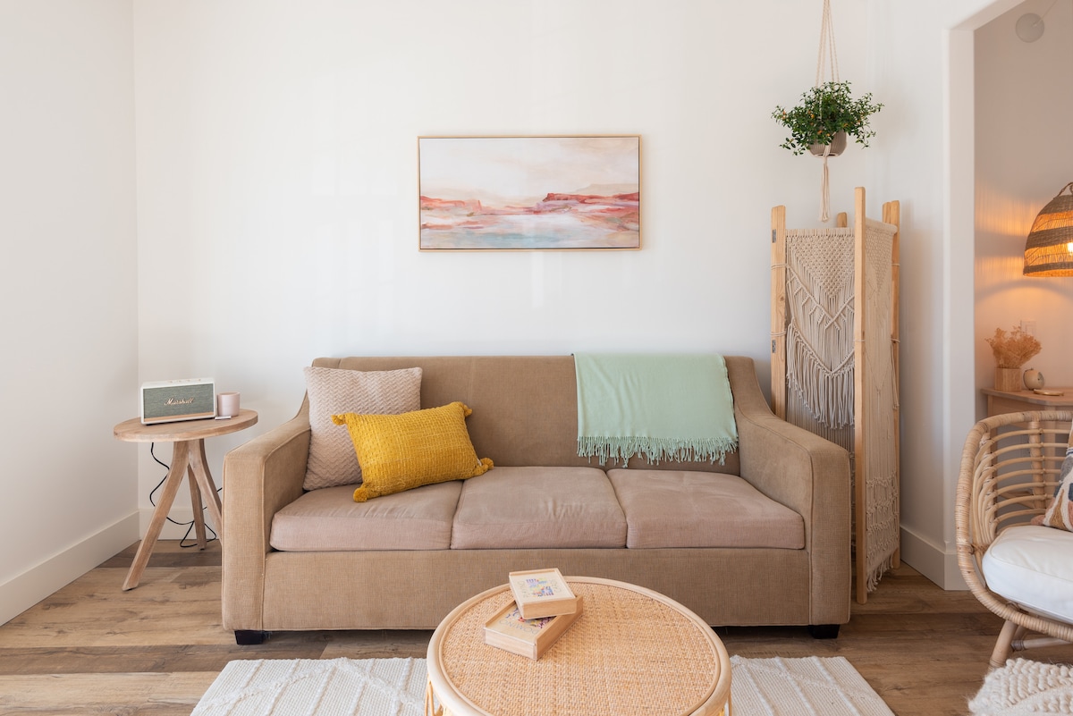 Pull-out couch with extra pillows and blankets